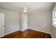 Spacious bedroom with hardwood floors, ceiling fan, and double door closet at 123 Arnold Pl, Jonesboro, GA 30236