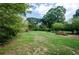Large backyard with mature trees and grassy area at 123 Arnold Pl, Jonesboro, GA 30236