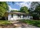 House exterior with gray brick, white siding, and blue front door at 123 Arnold Pl, Jonesboro, GA 30236