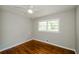 Bright bedroom with hardwood floors and two large windows at 123 Arnold Pl, Jonesboro, GA 30236