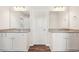 Double vanity bathroom with granite countertops and wood-look floors at 3024 Viewpark Cir, Conyers, GA 30013