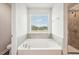 Bathroom with garden tub and shower, offering a view at 3024 Viewpark Cir, Conyers, GA 30013