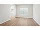 Bright dining room with light wood flooring and a view of the kitchen at 3024 Viewpark Cir, Conyers, GA 30013