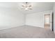 Bright bedroom featuring carpet flooring and access to a hallway at 3024 Viewpark Cir, Conyers, GA 30013