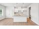 White kitchen with granite countertops and kitchen island at 3024 Viewpark Cir, Conyers, GA 30013