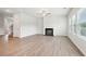 Spacious living room featuring a fireplace and wood-look flooring at 3024 Viewpark Cir, Conyers, GA 30013