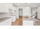 Bright kitchen with white cabinets, granite countertops and an island at 3024 Viewpark Cir, Conyers, GA 30013