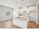 Modern kitchen with white cabinets, granite countertops and an island at 3024 Viewpark Cir, Conyers, GA 30013