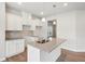 Kitchen features granite countertops, white cabinets, and a large island at 3024 Viewpark Cir, Conyers, GA 30013