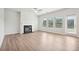 Bright living room with fireplace, wood-look floors, and sliding glass doors at 3024 Viewpark Cir, Conyers, GA 30013