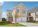 Two-story brick home with a two-car garage and attractive landscaping at 3024 Viewpark Cir, Conyers, GA 30013