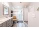 Modern bathroom with double vanity and walk-in shower at 1975 Wynhurst Xing, Stone Mountain, GA 30088