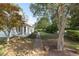 Landscaped front yard with walkway and mature trees at 150 E Main St, Rutledge, GA 30663