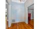 Spacious hallway with hardwood floors and painted accent wall at 150 E Main St, Rutledge, GA 30663