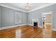 Bright dining room with hardwood floors, chandelier, and view into kitchen at 150 E Main St, Rutledge, GA 30663