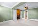 Living room featuring hardwood floors, a fireplace and ceiling fan at 150 E Main St, Rutledge, GA 30663