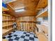 Unfinished basement with wood shelving and checkered floor at 150 E Main St, Rutledge, GA 30663
