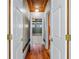 Hallway with hardwood floors and access to bedrooms at 150 E Main St, Rutledge, GA 30663