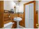 Small bathroom with pedestal sink, toilet and linen closet at 150 E Main St, Rutledge, GA 30663
