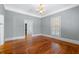 Elegant dining room with hardwood floors, chandelier, and fireplace at 150 E Main St, Rutledge, GA 30663