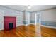 Hardwood floor bedroom with built-in shelving and fireplace at 150 E Main St, Rutledge, GA 30663