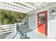 Inviting front porch with pergola and red door at 150 E Main St, Rutledge, GA 30663