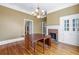 Spacious dining room featuring hardwood floors, fireplace, and built-ins at 150 E Main St, Rutledge, GA 30663