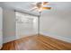 Hardwood floor bedroom with carpeted sitting area at 150 E Main St, Rutledge, GA 30663