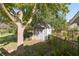 Yard storage shed with covered area and gardening tools at 150 E Main St, Rutledge, GA 30663