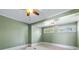 Bright bedroom with ceiling fan and two windows at 150 E Main St, Rutledge, GA 30663