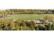 Aerial view of a soccer field with surrounding trees and parking at 6148 Indian Wood Se Cir, Mableton, GA 30126