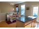 Kitchen with built-in bench seating, island, and hardwood floors at 6148 Indian Wood Se Cir, Mableton, GA 30126