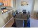Dining area with dark wood table, gray chairs, and kitchen view at 6148 Indian Wood Se Cir, Mableton, GA 30126