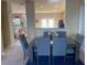 Elegant dining room with a six-person table and view into the kitchen at 6148 Indian Wood Se Cir, Mableton, GA 30126
