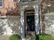 Front entrance of townhouse with brick exterior, columns, and double doors at 6148 Indian Wood Se Cir, Mableton, GA 30126