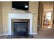 Modern gas fireplace with marble surround in living room at 6148 Indian Wood Se Cir, Mableton, GA 30126