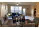 Spacious living room with hardwood floors, a sectional sofa, and access to a deck at 6148 Indian Wood Se Cir, Mableton, GA 30126