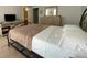 Well-lit bedroom with a dresser and ensuite bathroom access at 6148 Indian Wood Se Cir, Mableton, GA 30126