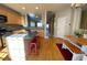 Open concept kitchen with island, hardwood floors, and view of living area at 6148 Indian Wood Se Cir, Mableton, GA 30126
