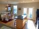 Bright kitchen features an island, breakfast nook, and access to a deck at 6148 Indian Wood Se Cir, Mableton, GA 30126