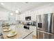 Modern kitchen featuring stainless steel appliances and granite countertops at 1012 Northfield Dr, Conyers, GA 30013