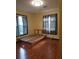 Bedroom featuring hardwood floors and striped curtains at 2010 Driftwood Cir, Cumming, GA 30041