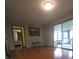 Bright living area with hardwood floors and view of the screened porch at 2010 Driftwood Cir, Cumming, GA 30041