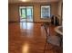 Spacious living room with hardwood floors and access to a screened porch at 2010 Driftwood Cir, Cumming, GA 30041
