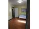 Simple bedroom with hardwood floors and good natural light at 2010 Driftwood Cir, Cumming, GA 30041