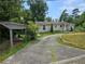 Ranch home with carport and mature landscaping at 2010 Driftwood Cir, Cumming, GA 30041