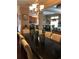 Elegant dining room with a large table, neutral colored chairs, and a kitchen view at 1175 Grassy Oat Ln, Lawrenceville, GA 30045