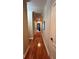 Bright hallway with hardwood floors and crown molding at 1175 Grassy Oat Ln, Lawrenceville, GA 30045