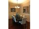 Formal dining room with dark wood table and chandelier at 1175 Grassy Oat Ln, Lawrenceville, GA 30045