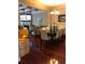 Bright dining room with hardwood floors and a view into the living room at 1175 Grassy Oat Ln, Lawrenceville, GA 30045